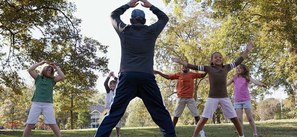 Children doing jumping jacks